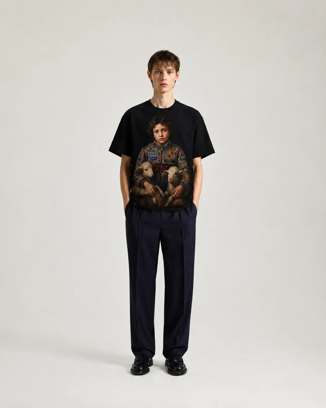 TARO SHINODA black oversized graphic t-shirt featuring a multi-figure artwork print centered on the chest, front view.